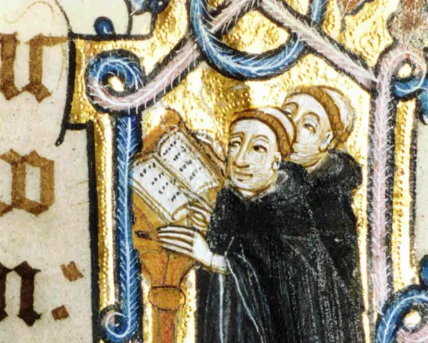 Illuminated manuscript shows Benedictine monks studying a book, illustrating how Benedictine monks spent their time in prayer and learning.