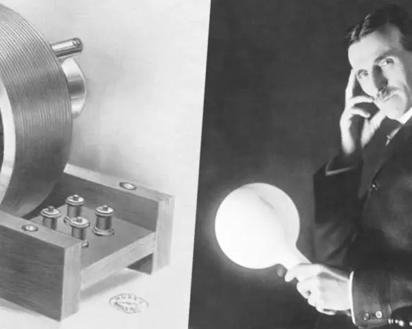 Nikola Tesla z cewką i świecącą żarówką.