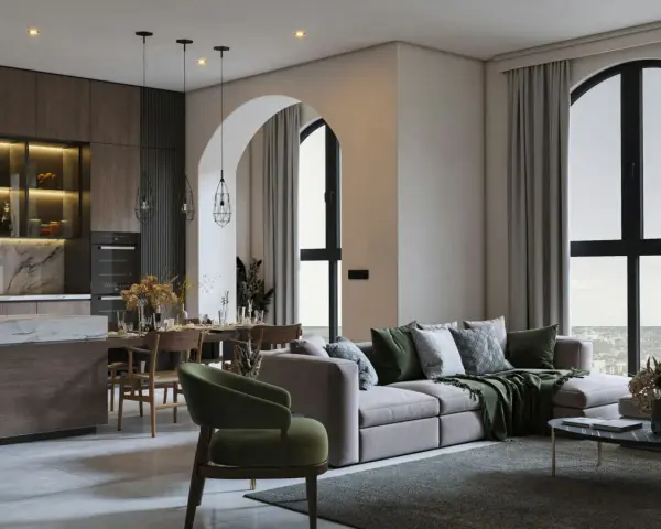 Un soggiorno con cucina open space, un divano moderno e un tavolo da pranzo. L'arredamento casa moderno crea un ambiente accogliente.