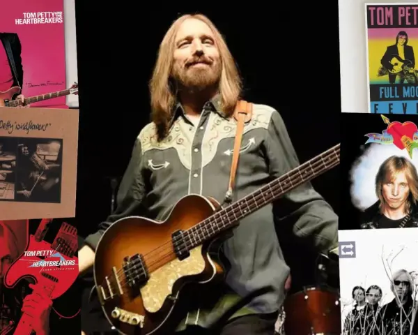 Tom Petty mit Bass, umgeben von Albumcovern wie "Full Moon Fever" und "Wildflowers". Ein Blick auf die Musikikone.