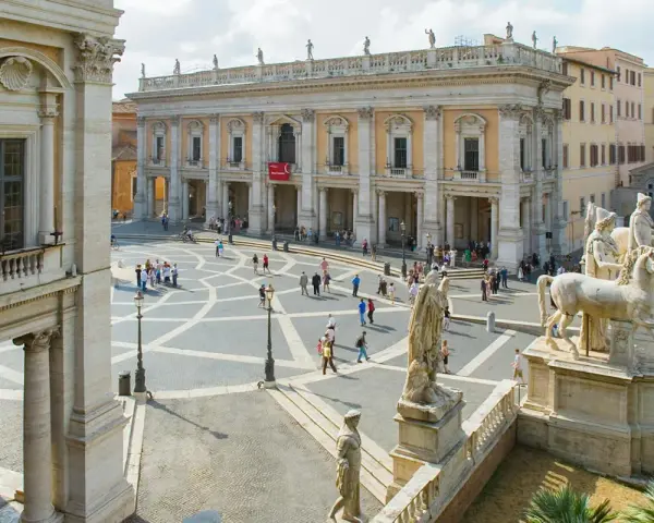 Piazza del Campidoglio, Rome, with the Capitoline Museums' facade and statues.
