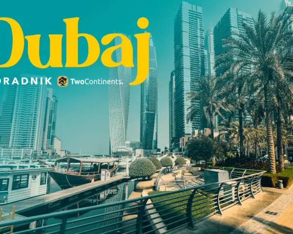 Dubaj: czy do Dubaju trzeba paszport? Widok na nowoczesne drapacze chmur, palmy i przystań z łodziami.