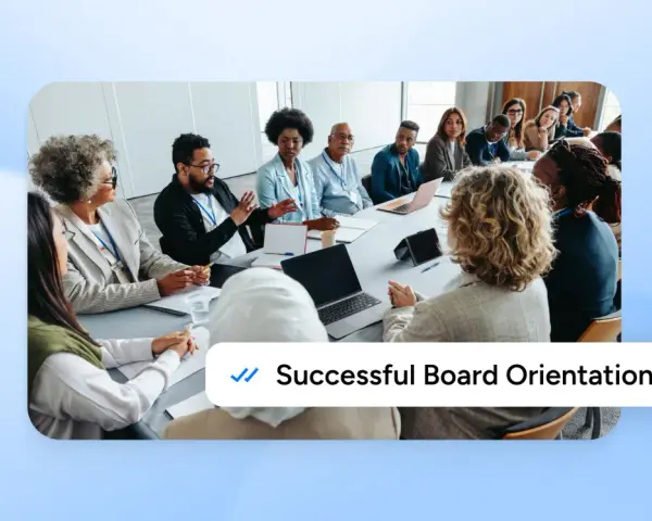 A diverse group of people are seated around a conference table, engaged in discussion during a new board member orientation.