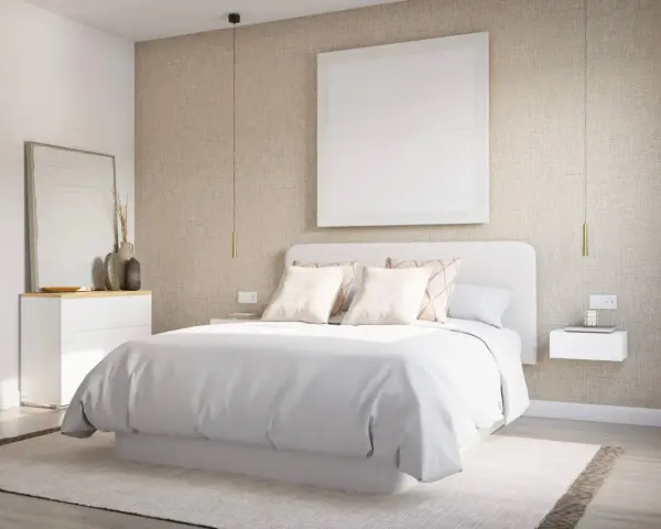 Una serena habitación blanca con cama vestida de blanco, mesitas de noche flotantes y un cuadro minimalista.