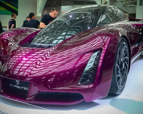 A stunning purple concept car, showcasing the future of automotive 3d printing with its sleek, futuristic design.