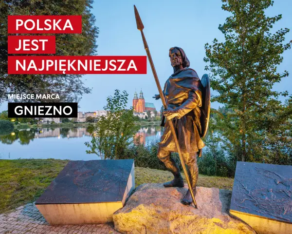 Pomnik w Gnieźnie, nawiązujący do legendy o orle białym. W tle jezioro i katedra.