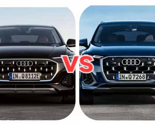 Dwa Audi Q7, czarne i niebieskie, z napisem VS pośrodku.