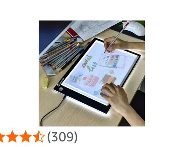 En person använder ett ljusbord för att rita en "wish list" med färgpennor och akvareller.