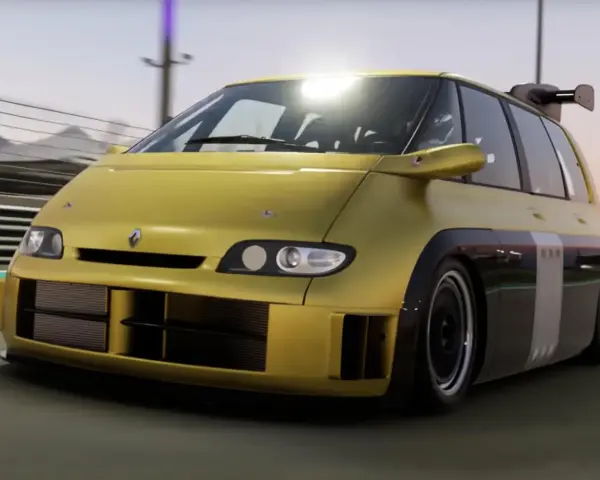Żółty Renault Espace F1 z potężnym spojlerem pędzi po torze wyścigowym.