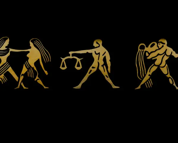 Złote symbole zodiaku: Bliźnięta, Waga (jaki żywioł powietrza), Wodnik na czarnym tle.