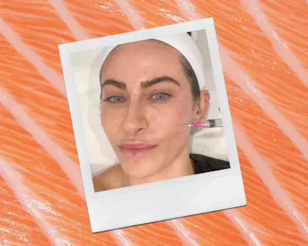 A woman receives a cosmetic injection, possibly part of a salmon sperm facial treatment, against a backdrop of salmon flesh.