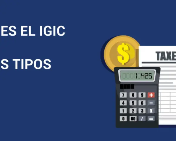 Calculadora y moneda dorada junto a un documento de "TAXES". Averigua cuanto es el IGIC en Canarias y sus tipos.