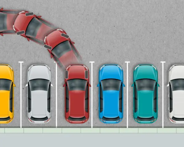 Schemat ilustrujący parkowanie prostopadłe. Czerwony samochód wykonuje manewr wjazdu na miejsce parkingowe.
