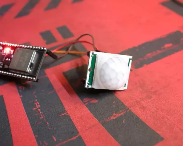ESP32 board connected to a PIR motion sensor, ready for esp32 presence detection projects.