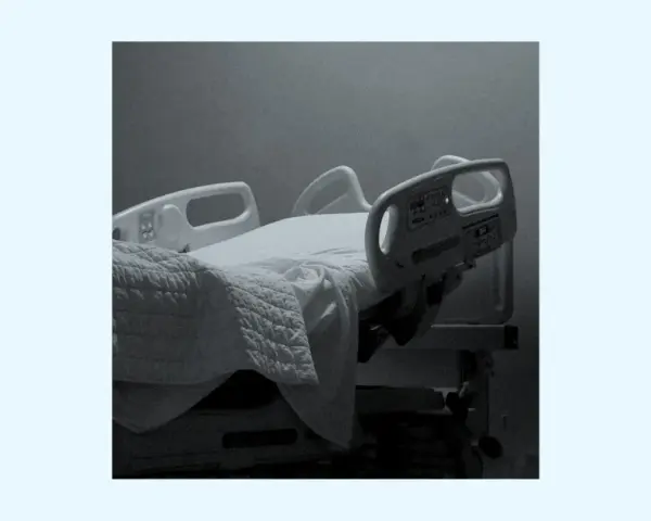 An empty hospital bed, a symbol of loss and unanswered questions. Does God forgive suicide? This image evokes the pain and uncertainty surrounding such a tragedy.