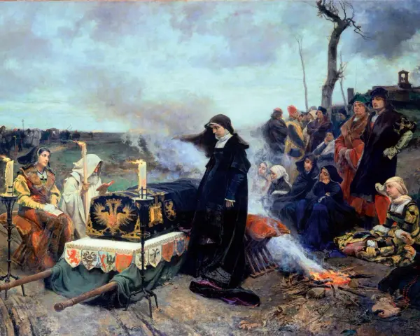 Los hijos de Juana la Loca y Felipe el Hermoso, en un cortejo fúnebre, acompañan un féretro bajo un cielo nublado.