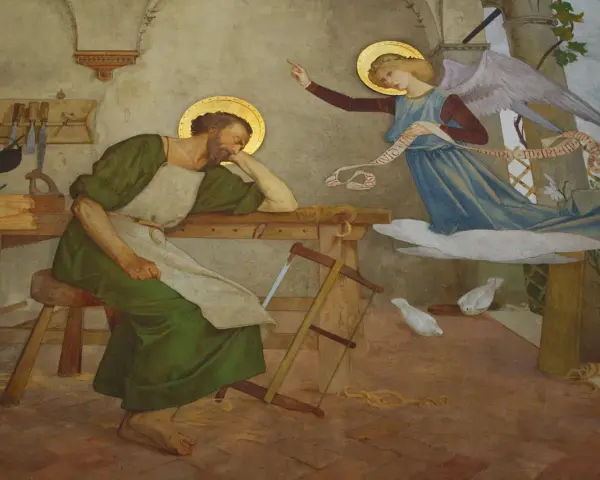Ein Engel erscheint dem schlafenden Josef, der als der vater von Jesus gilt, und verkündet ihm die Botschaft.