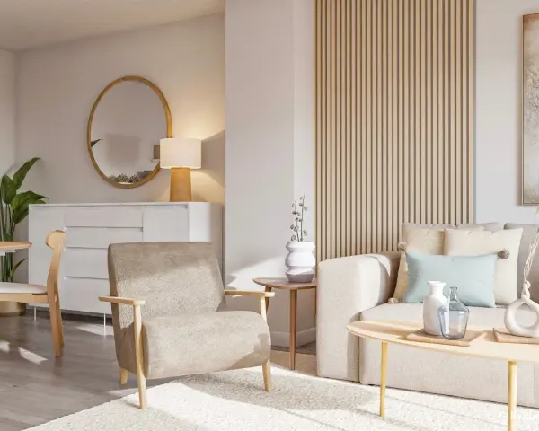 Salón acogedor con sofá y sillón en tonos tierra, mesa de centro de madera y detalles decorativos en colores neutros.