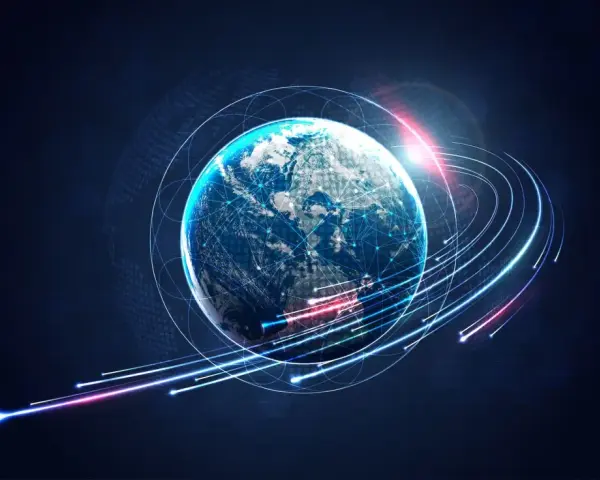 Ziemia otoczona siecią połączeń, symbolizująca globalną komunikację. Odpowiada na pytanie, kiedy powstał internet, pokazując jego wszechobecność.