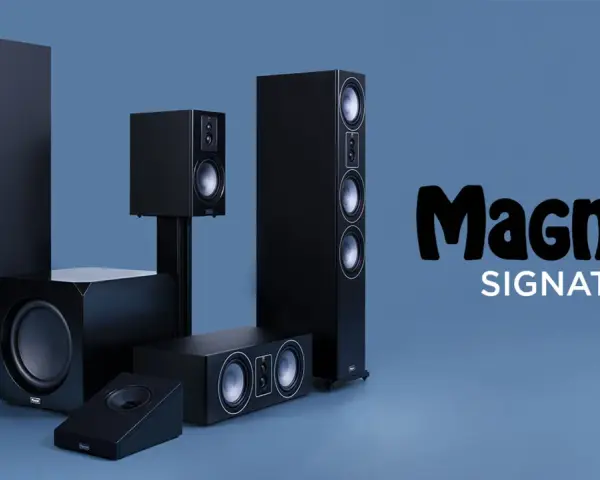 Zestaw czarnych głośników Magnat Quantum 605, w tym kolumny podłogowe, subwoofer i głośniki centralne, prezentuje się elegancko na niebieskim tle.