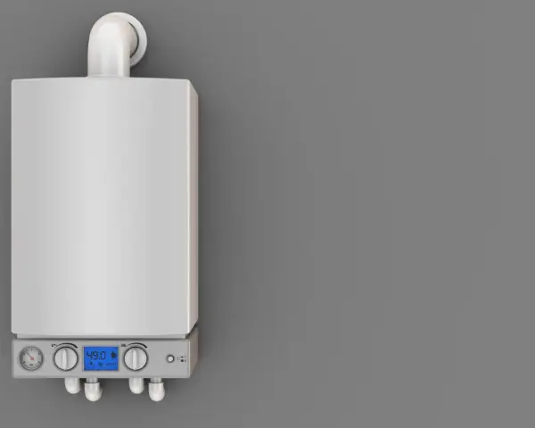 Caldaia moderna con display digitale e manometri. Il tubo scarico fumi caldaia normativa è visibile in alto, essenziale per la sicurezza.
