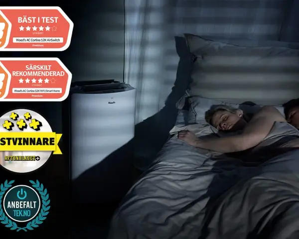 Ett par sover lugnt i mörkret medan en luftfuktare sovrum står bredvid sängen, med utmärkelser som "Bäst i test" och "Särskilt rekommenderad".