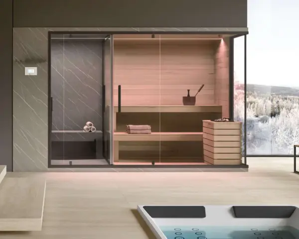Un'elegante **spa in casa** con sauna in legno, doccia e vista panoramica su un paesaggio innevato.