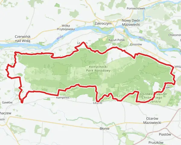Mapa z zaznaczonym Kampinoskim Szlakiem Rowerowym, biegnącym przez Kampinoski Park Narodowy, w pobliżu Wisły i miejscowości takich jak Zakroczym czy Ożarów Mazowiecki.