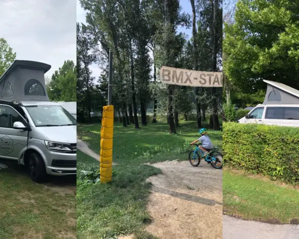 Kamper i rowerowy tor BMX na kempingu w Wiedniu. Dziecko na rowerze, baner "BMX-STAR".