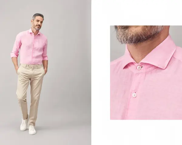 Uomo con camicia rosa e pantaloni beige, un look casual chic. Perfetto per abbinare camicia rosa uomo con stile.