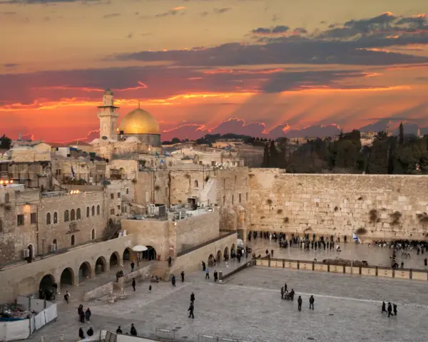 Sunset over Jerusalem's Old City, with the Dome of the Rock and the Western Wall, a glimpse of Solomon's Temple today.