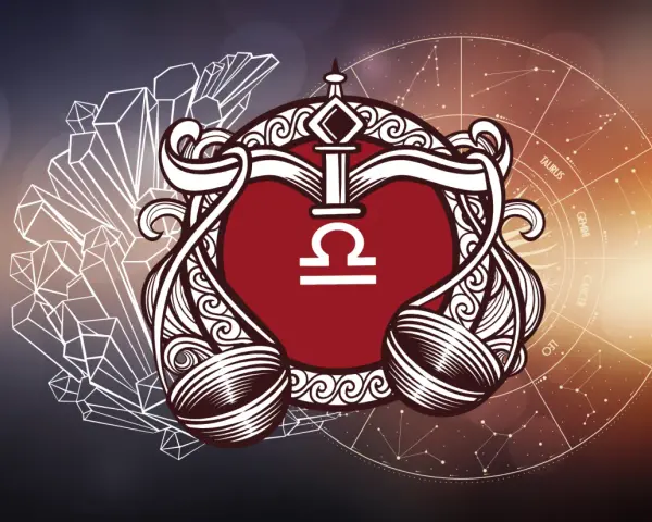 Symbol Wagi, który żywioł powietrza, w ozdobnej ramie, na tle kryształów i zodiaku.