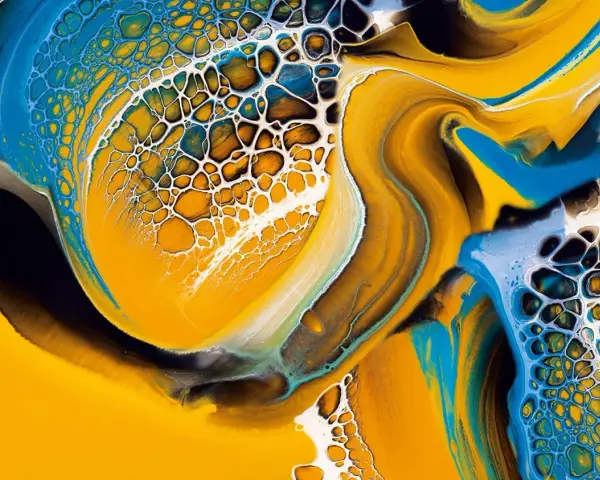 Vibrant yellow, blue, and white paint swirls create a mesmerizing cellular pattern, a testament to the ultimate pouring technique.