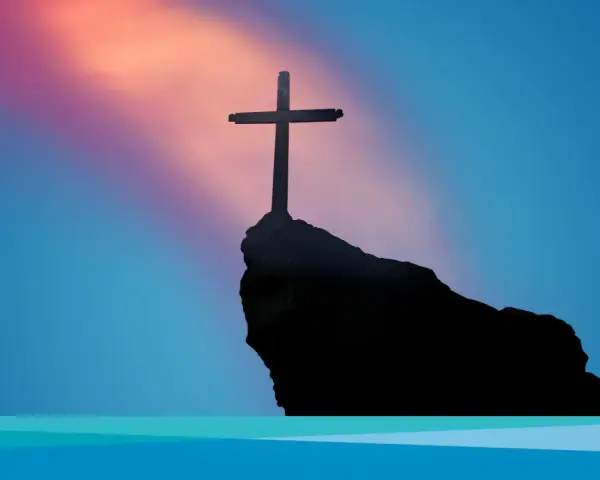 Ein Kreuz ragt auf einem Felsen empor, vor einem farbenprächtigen Himmel. Ein Symbol für Karfreitag und die Hoffnung, die in den Karfreitag Bibelversen liegt.