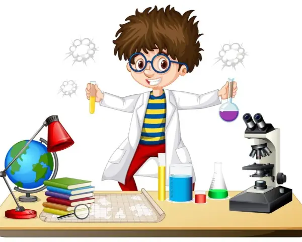 Chłopiec w fartuchu laboratoryjnym z dumą prezentuje swoje **eksperymenty chemiczne dla dzieci**. Na stole stoją probówki, mikroskop i globus.