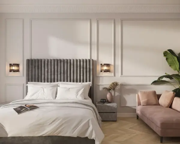 Elegancka sypialnia z łóżkiem, różową sofą i rośliną.