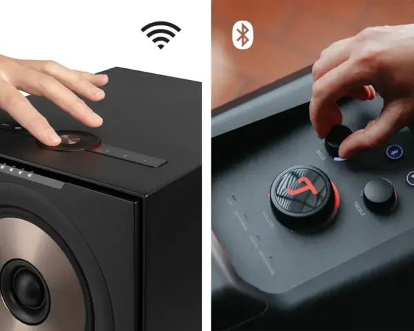 Hände bedienen Lautsprecher. Ein Lautsprecher zeigt ein WLAN-Symbol, der andere ein Bluetooth-Symbol. So funktioniert Bluetooth: kabellose Verbindung für Musik.