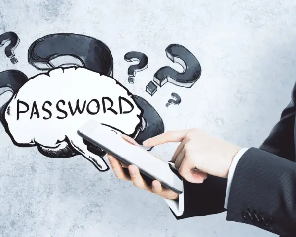 Dłoń trzyma tablet, a nad nim chmurka z napisem "PASSWORD" i znaki zapytania. Jak wymyślić hasło?