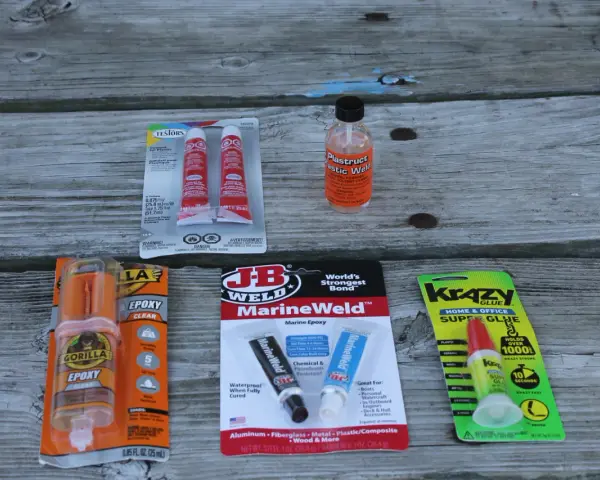 Exploring adhesives for plastic to metal: Gorilla Epoxy, JB Weld MarineWeld, and Krazy Glue are shown.