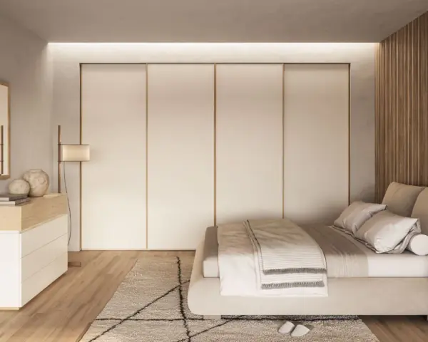 Camera da letto scandinava con letto accogliente, armadio a scomparsa e comò in legno chiaro. Un'oasi di pace in stile nordico.