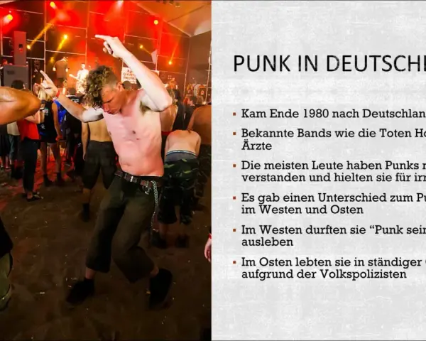 Junge Männer tanzen ausgelassen zu Punk-Songs auf einem Festival. Die Szene zeigt die Energie und Rebellion der Punk-Bewegung in Deutschland.