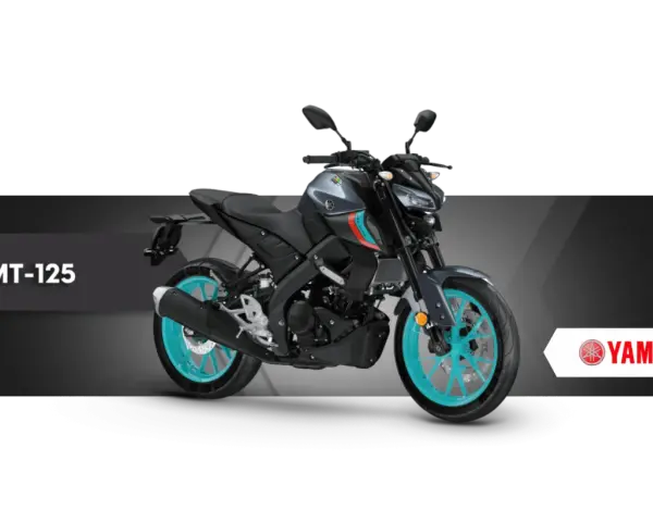 Szary motocykl Yamaha MT-125 z turkusowymi felgami, gotowy na miejskie przygody.