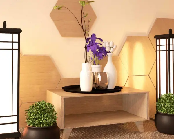 Ideas para como adornar una mesa de salon: dos lámparas, plantas, jarrones con flores y un detalle metálico sobre un mueble de madera.