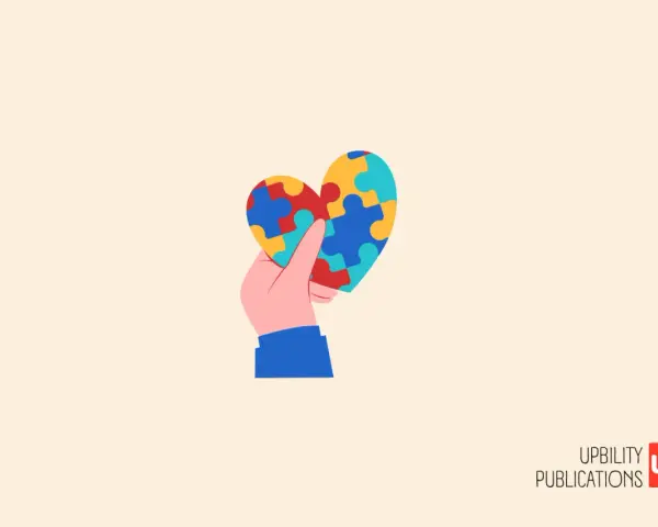 Mano che tiene un cuore a puzzle colorato, simbolo di comprensione e accettazione per l'autismo grado 1.