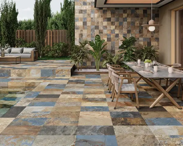 Terraza moderna con suelo de baldosas de colores, antideslizante el mejor suelo para exterior. Mesa y sillas listas para disfrutar.