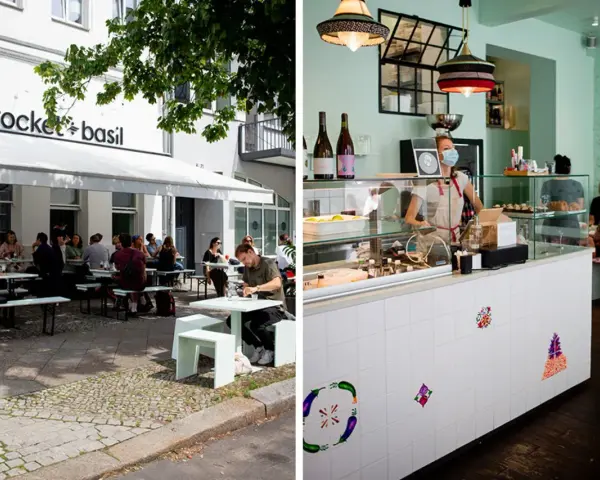 Außenbereich eines Restaurants in Berlin mit Gästen, innen ein Tresen mit einer Mitarbeiterin. Ein gemütliches persisches Restaurant Berlin.