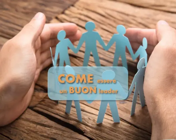 Mani che proteggono figure di carta unite, simboleggiano come delegare un proprio compito ad altri sia fondamentale per un buon leader.