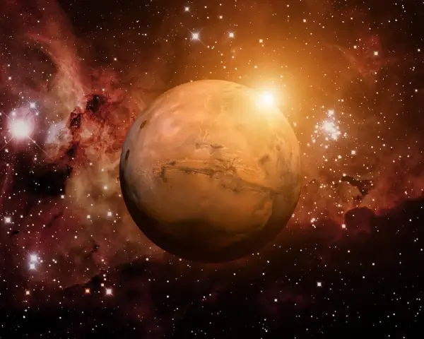 El planeta Marte brilla en el cosmos, rodeado de nebulosas y estrellas. Su superficie rojiza evoca la energía de una marte carta astral, guiando destinos.