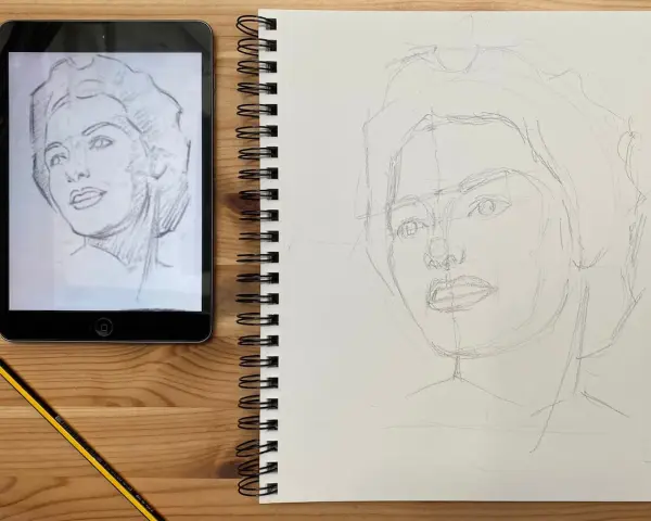 Un boceto a lápiz de un retrato en una tableta inspira un nuevo dibujo en un cuaderno. Aprende como dibujar un retrato observando los pasos.