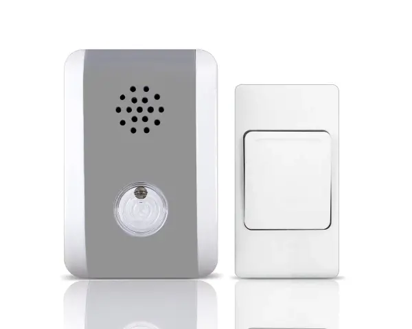 Un timbre inalámbrico para casa, con un receptor gris y blanco y un pulsador blanco.